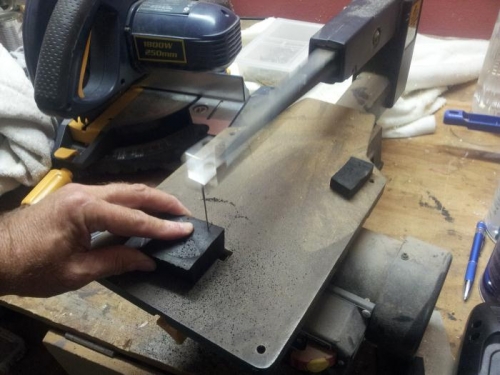 Cutting the elevator stop block from a block of rubber ...
