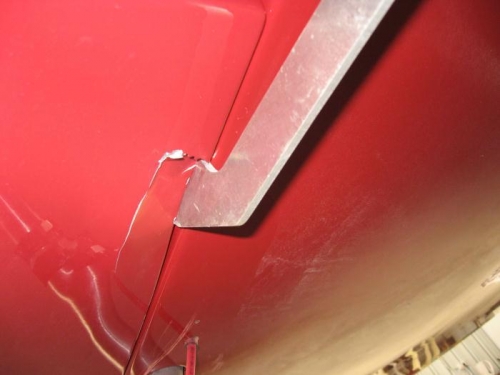 The lower wing skin cracked when the wings were refitted.