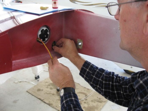 Trial fit of the fuel tank strainer.