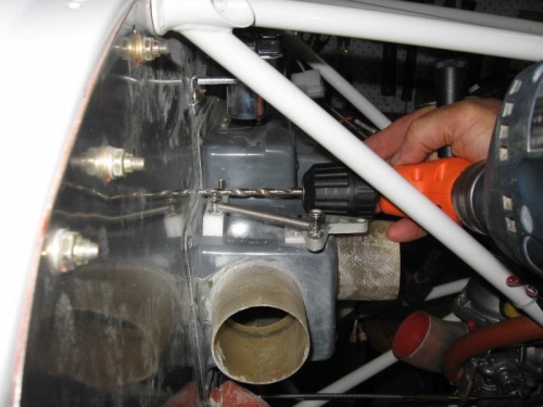 Using 90o angle drill to drill hole for  carbi heat cable.