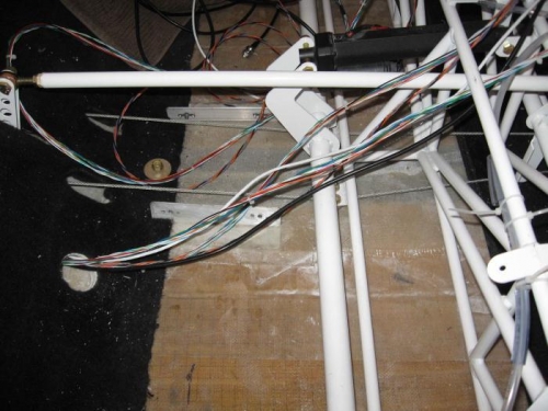 Wiring coming forward through lower seat back.