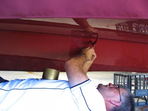 Fitting split pins to the castle nuts on the flap mount bolts.