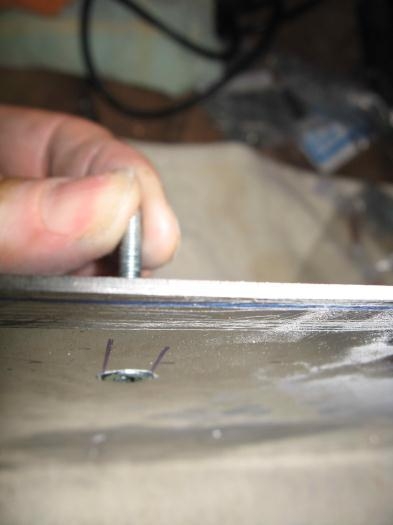 Countersinking into the panel.