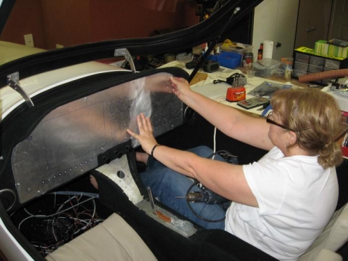 Sheryl helping to hold the panel in position.