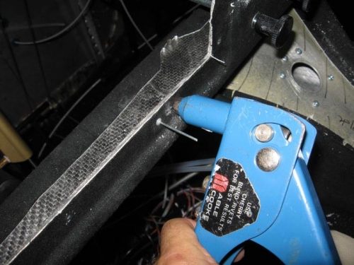 Riviting the nut-plates into place.