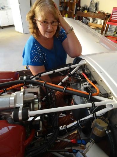 Sheryl helping with draining the fuel - yet again!