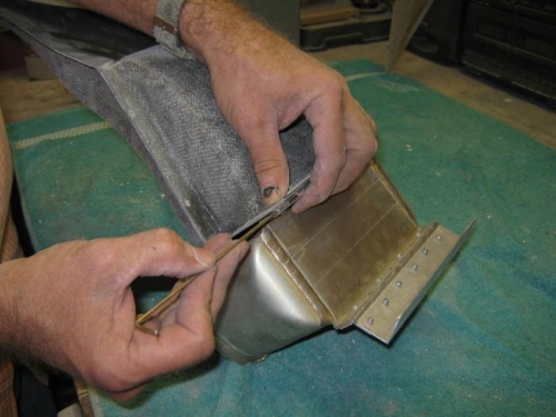 Sliding pins in to attach the duct to the cooler.