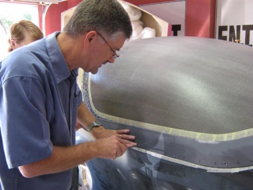 Placing and scewing the skin over the wet epoxy.