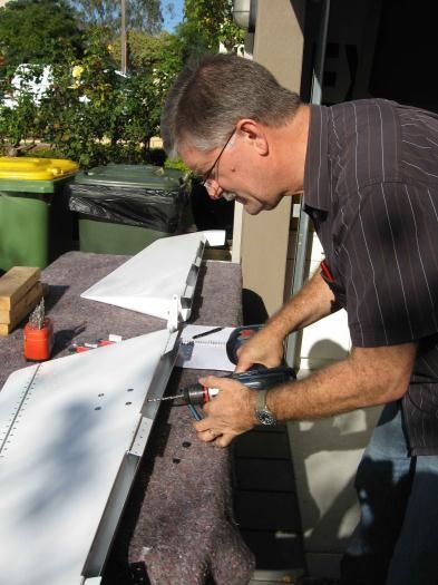 Drilling the access hole for trim cable