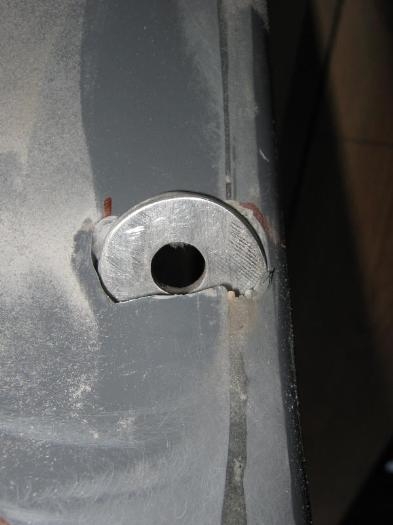 Top protruding through the top of the panel.