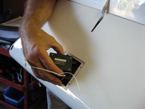 Positoning the trim motor inside the elevator.