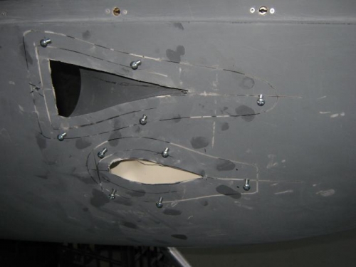 Ducst held in place with self-tappers.