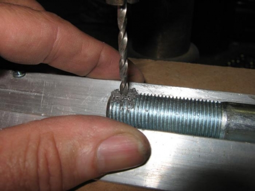 Drilling the hole in the axle for the split pin.