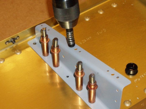 Drill out rivet holes