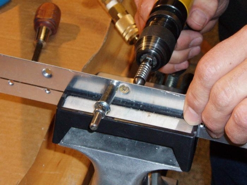 Drilling rivet holes with platenut securely centered