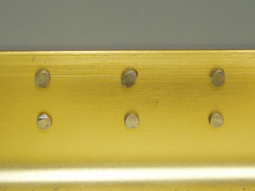 Clinched rivets on top row