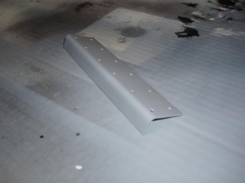 Primed mating surface of splice plate