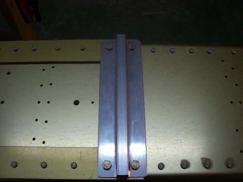 4 Holes drilled in tie-down assembly
