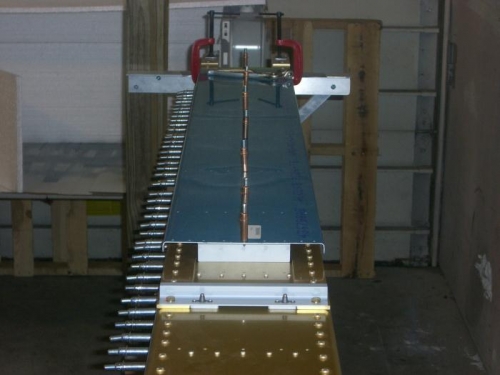 Tank baffle clecoed on