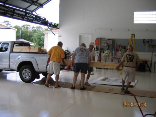 Slide 2 boxes onto hangar floor