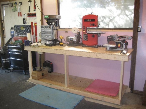 Work bench with drill press, bench grinder, band saw and bench sander
