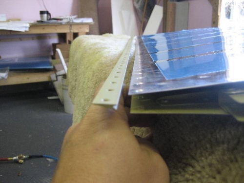 This is the wedge that gets glued/riveted between the skin trailing edges