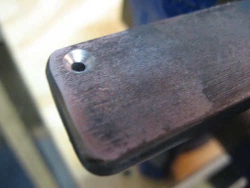 The piece of steel with a countersunk hole the size of the female dimple die.