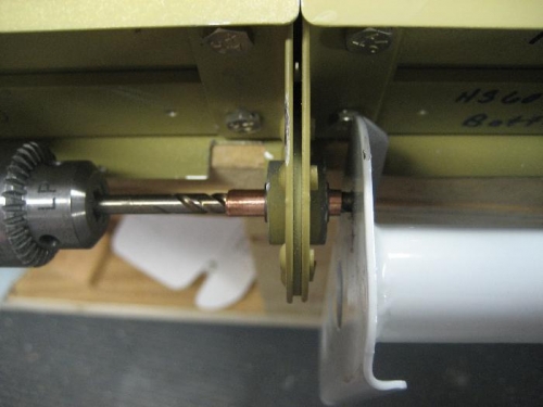Drilling the RH elevator horn through the rear bearing (note brass bushing)