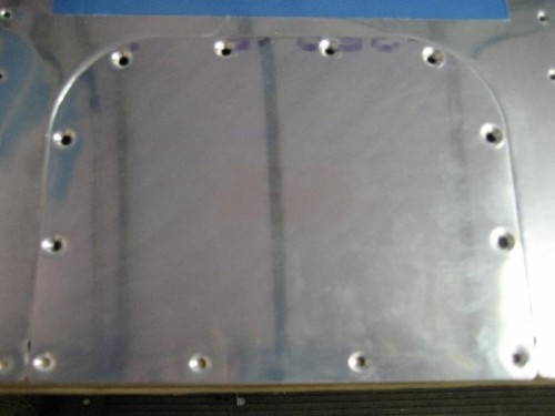 Drilled, de-burred, dimpled and edge finished the inspection panels