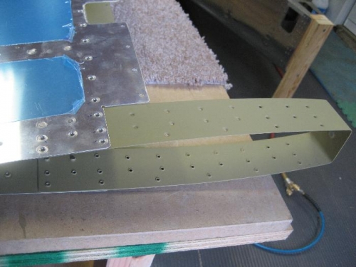 Counterweight skin (right) is riveted (2 rivets/side) to the elevator skin (left)