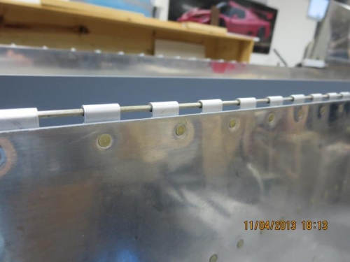 Flap Hinge Riveted to Wing