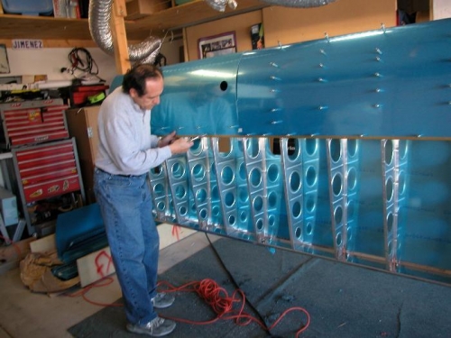Match drilling the fuel tank skin onto the w-706 main spar