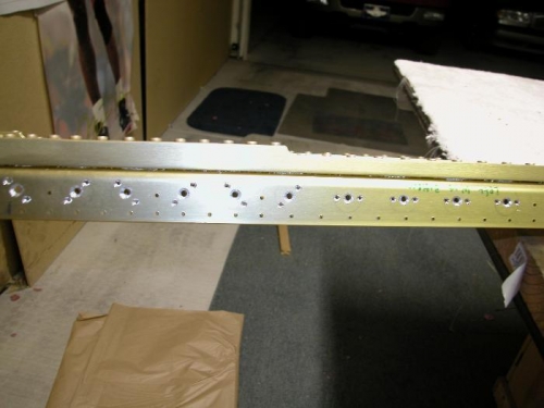 Countersink holes on left wing main spar.