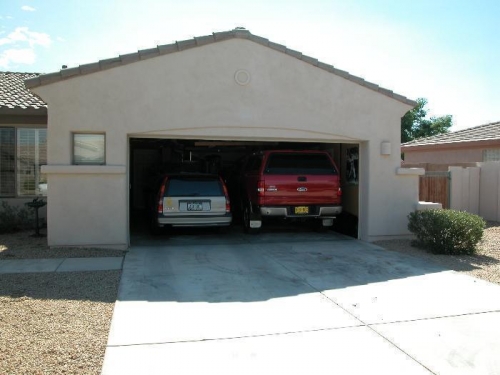 Garage door open with both vehicles.