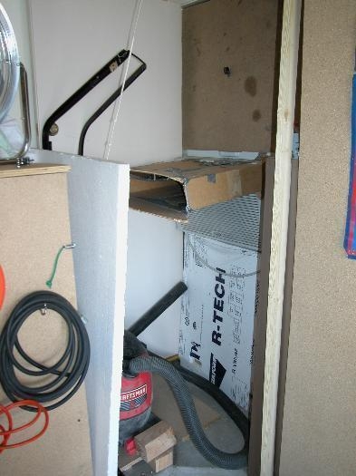 Air Conditioner in the corner of the garage.