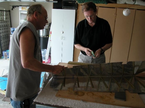 Showing my friend Chris Cummins and Brother in Law Sean Shelley how to rivet the stiffner on elevator
