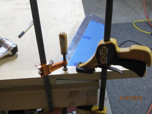 Trim tab clamped for bending tabs