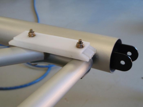 Rear spar attach/aileron cable guide