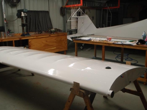 Unmasked wing and forward spar attach bolt drilled and reamed to 3/8