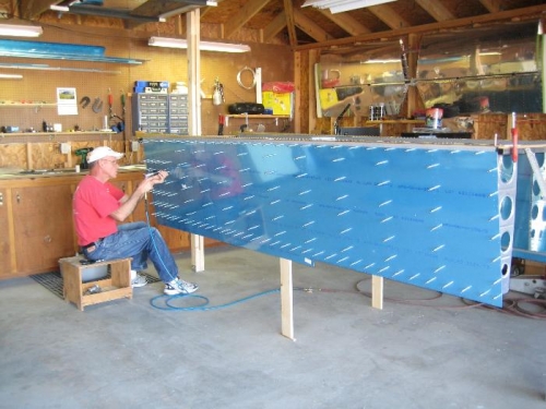 Dad's old trimming stool makes a good bench to sit on.