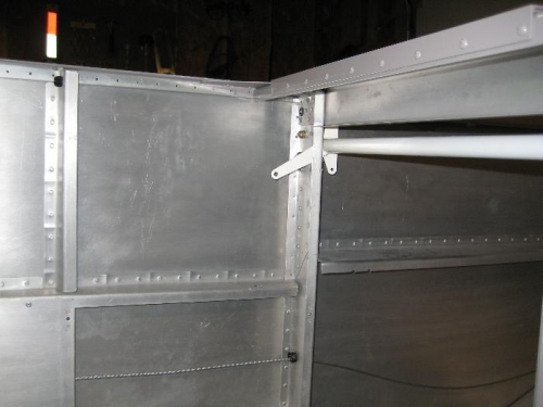 Arm welded on back side of rod