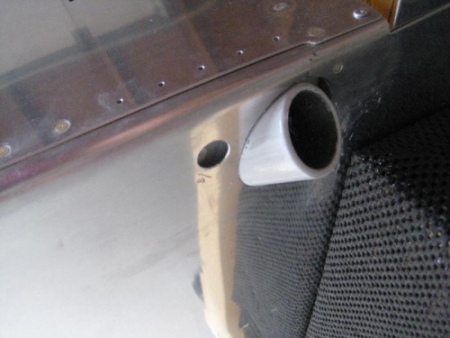 Gear weldment protruding through hole cut in bottom of fuselage