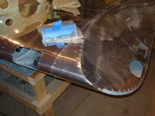 Holes in wing, landing light lens.