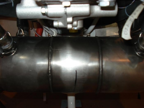 Muffler shoved to left.