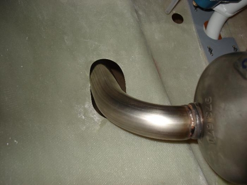 Pipe against outboard side of hole.