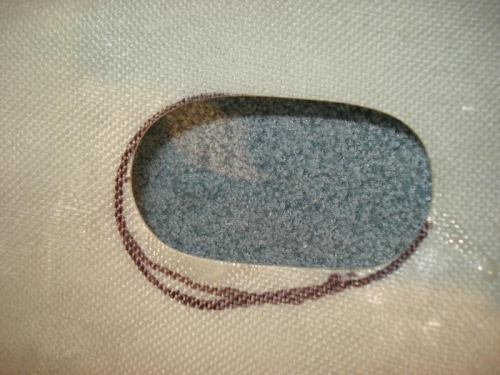 Exhaust exit hole marked for enlargement.