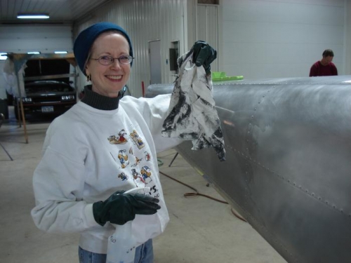 Brenda cleans fuselage.