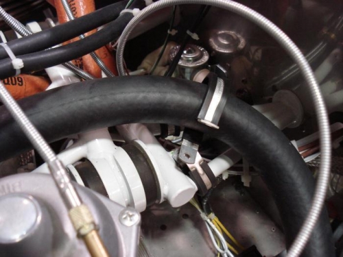 Working on coolant hose stand-off.