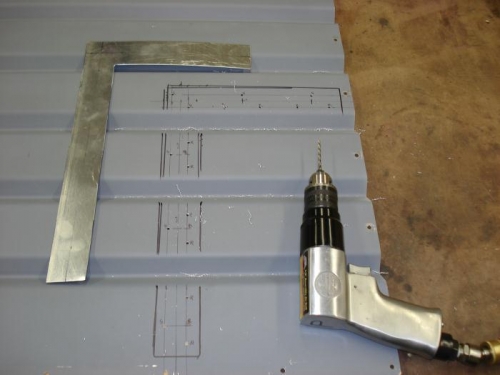 Laying out access panel cut.