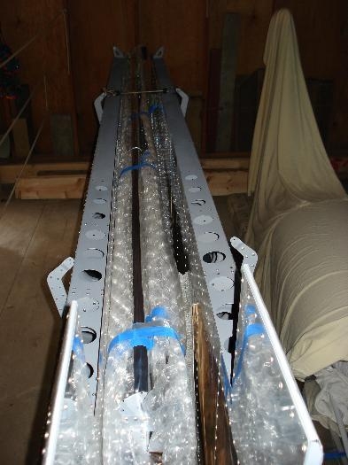 Flaperons stored on top of wing rack.